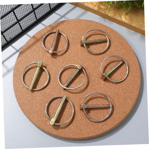 12 Piece Heavy Duty Lynch Pin Kit Locking Clips For Farm Tractors Trailers And Mowers, Bulk Supply For Agricultural And Industrial Use, Durable Wear Resistant Construction, Easy Release, Secure Latch Pins For Trailer Safety, 12 metal lynch pins on cork board