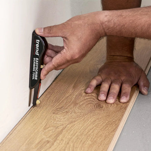 EasyScribe Scribing Tool for Accurate Layouts Across Carpentry, Joinery, Tiling, Kitchen Fitters, and Shop Fitters with a Pro Grade Adjustable Offset Arm From 0.04 to 1.57 Inches, Black in use on wooden surface
