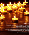 Burning tea lights on wood surface with a caution notice, related to All In One Candle Making Kit With 100 Six Inch Cotton Wicks 30 Sticker Sets.