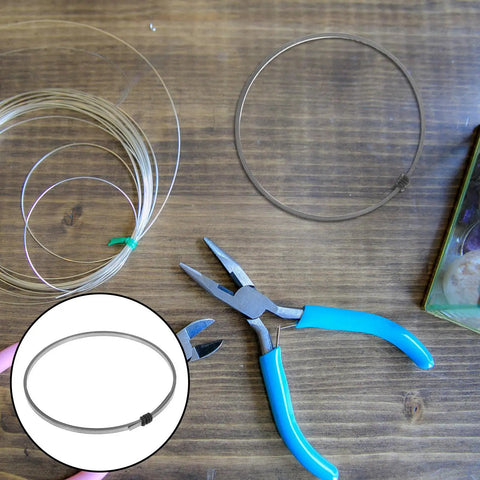 Premium Nickel Chromium Heating Element Replacement Strip For Heat Shrink Film Sealer on wooden surface with pliers and wire.