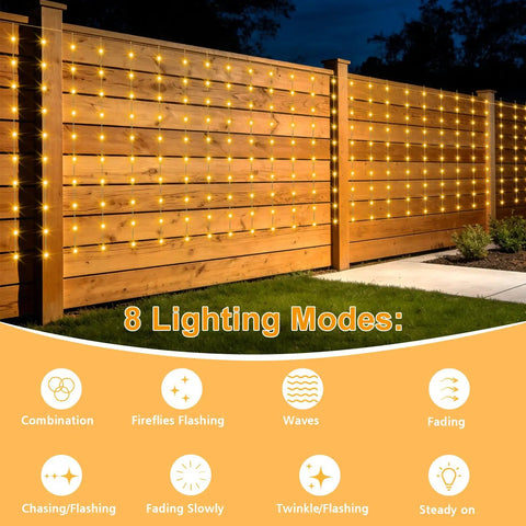 Outdoor Solar Curtain Lights 200 LED Warm White, 13ft By 3.9ft Waterproof String Lights on wooden fence at night.