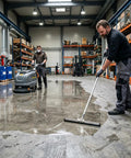Men applying Heavy Duty Penetrating Concrete Sealer And Hardener For Garage Driveways And Basements in a warehouse setting.