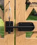 Tough As Nails Heavy Duty Gate Latch With Cable Pull For Wooden Fence, black powder coat finish on wooden gate.