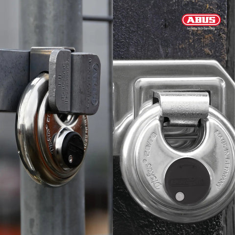 Beefy Heavy Duty Diskus Storage Padlock 70mm Wide For Outdoor And Commercial Use Keyed Alike With 2 Keys Included Rugged Security Lock For Storage Units And Sheds 2.75in Wide Durable Steel Construction on gate
