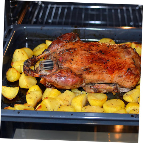 Stainless Steel Peking Duck Keeping Tool for Even Cooking with roast duck in oven surrounded by potatoes, in baking tray