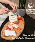 Top Shelf Nine By Twelve Inch Clear Plastic Ziplock Bags Quick Snap Zip Seal And Writable White Label Blocks Five Hundred Count on a kitchen counter.