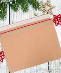 A4 Self Sealing Kraft Brown Envelopes Pack Of 30 Thickened Flat Cardboard Mailers on a festive wooden surface