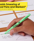 Hand using Pocket Highlighters In Soft Pastel Assorted Colors, 12 Count, Slim Chisel Tip For Highlighting on notebook paper.