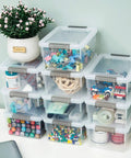 Stacked clear white 10 pack 1.3 Qt small storage bins with lids, visible organization of art supplies, tidy and space-saving design
