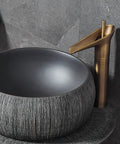 No Cap Top Tier Handmade Ceramic Vessel Bathroom Sink Set With Heavy Duty Pedestal Base And Included Faucet Hardware For Indoor Outdoor Makeover Built Tough And Super Clean Aesthetic featuring dark ceramic bowl and stylish faucet.