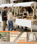Portable Farmers Market Stand With Foldable Canopy On Wheels shown in street setup with wooden frame and food items displayed