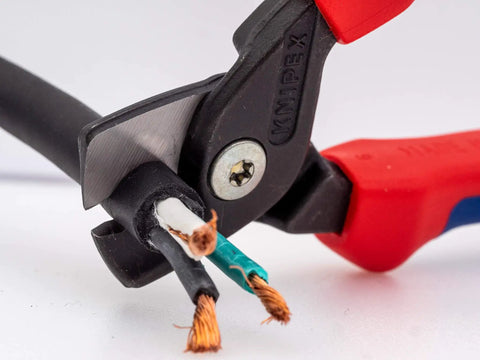 StepCut Cable Shears 6.25 Inch With Insulated Grips For Copper And Aluminum Multicore Wire cutting black cable close-up.