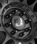 Close-up of truck wheel with 14mm 1.5 Lug Nuts Set For Ford F 250 F 350 2017 To 2024 32 Piece Flat Or Mag Seat