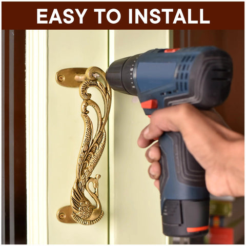 Installing peacock decorative brass door handles on interior door with drill.