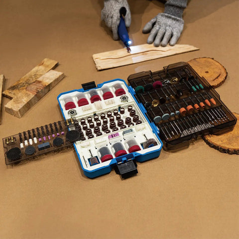 652-Piece All-In-One Rotary Tool Accessory Kit Dremel Compatible For Grinding Sanding Cutting Drilling Cleaning Polishing And Carving With Silicon Carbide And Aluminum Oxide Wheels Diamond Grinding Bits HSS Drills Wire Brushes Wool Polishing Wheels open case on wood table