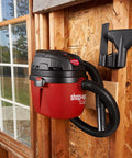 1.5 Gallon 2.0 Peak Wet Dry Vacuum For Quick Cleanups At Home, Garage, Or Vehicle, mounted on wall in garage