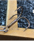 Close-up of barbed hook from 10 Piece Spinnerbait Fishing Lures Kit With Tackle Box For Freshwater And Saltwater Angling.