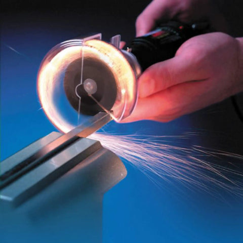 PowerPro Variable Speed Rotary Tool Kit With 85-Piece Accessory Set, cutting metal with sparks using cutting guide at high speed.