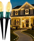 Outdoor Christmas Pathway Lights 2 Pack, 51.4 Ft Total, 40 Bulbs, illuminating a house walkway and garden area at night.