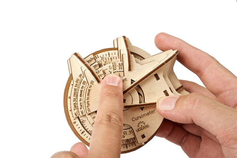 STEM Lab Math Series Curvimeter Puzzle Kit With App Unique Educational Engineering 3D Puzzles For Hands On Learning Map Measurer Toy That Lets You Measure Curved Lines, wooden curvimeter in hands