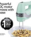 Smooth Operator 5 Speed Electric Hand Mixer With Slow Start Tech And Quick Burst Design Includes Stainless Steel Twisted Wire Beaters Whisk And Secure Snap On Case For No Stress Baking Prep In Classic Mint mixing cookie dough in a clear bowl.