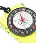 Close-up of orienteering compass with acrylic dial, showing direction guide, for hiking and backpacking.