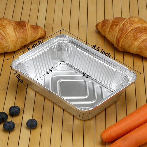 60 Pack Aluminum Foil Pans With Lids, 8.5 By 6 Inch, 2.25 Lb Capacity, displayed with croissants and carrots on a wooden surface
