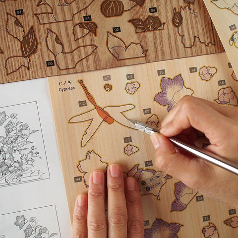Crafting Ukiyoe Art Kit Dragonfly And Bellflower Inspired By Hokusai Made In Japan on cedar Cypress wood sheet with cutting tool.