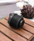Black 2 Pack Bicycle Front Fork Damping Rod Knob Lock Cap, 27.5mm Threads, 30mm Length, Plastic Shock Absorber, on wooden surface