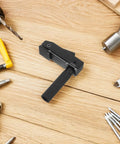 Compact Portable Aluminum Woodworking Clamp With Quick Clamping Function on wooden workbench surrounded by tools
