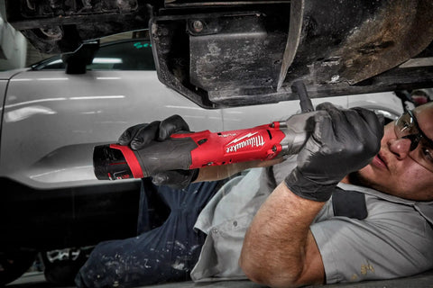 Mechanic using M12 Fuel Half Inch Right Angle Impact Wrench Kit With Powerstate Brushless Motor Delivers Up To 298 Nm Of Torque