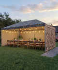 Outdoor setup with No Nonsense Tough 9 Mil Tarp Cover Waterproof UV Resistant Tarpaulin on canopy, lit with string lights.