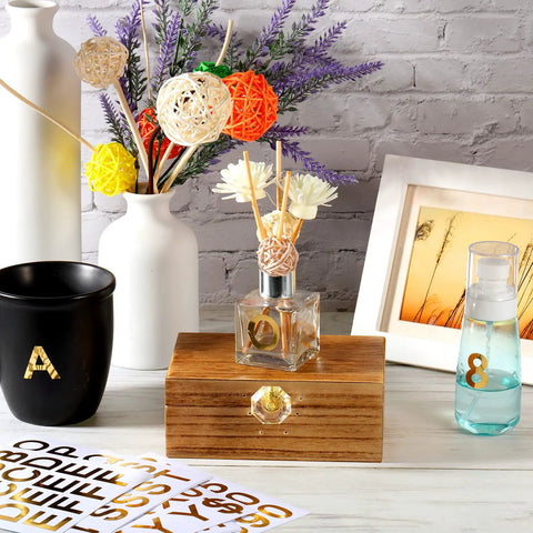 Gold Self Adhesive Vinyl Letter Stickers 202 Pcs 8 Sheets 1 Inch Alphabet And Number Stickers displayed on decor items