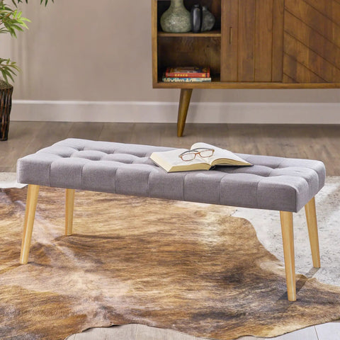 16 Inch Solid Rubber Wood Table Legs With M8 Hanger Bolts A Total Game Changer For Refreshing Your Setup Sleek Tapered Shape Fits Coffee Table And End Tables No Sweat Assembly with gray upholstered bench and book.
