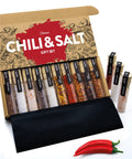 Open box of Salt And Chili Gift Kit For Men, showcasing 5 gourmet sea salts and 5 hot chili varieties, with decorative packaging.
