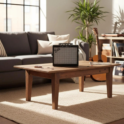 MD 20 Mini Deluxe Guitar Amp Bundle With Power Supply, Instrument Cable, Picks sitting on wooden coffee table in cozy living room