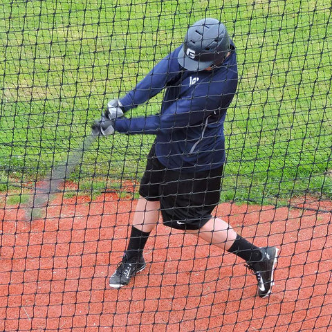 Baseball And Softball Batting Cage Net For Backyard Setup with player swinging inside netted enclosure.