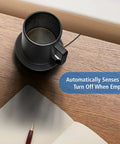 Premium Self Heating Rechargeable Coffee Mug With Precise Temperature Control And A Leak Proof Lid on a wooden desk, sensing when empty.