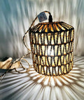 Rattan Wall Lamp With Plug In Cord Hand Woven Lantern Shade Farmhouse Wood Holder Boho Wall Sconce For Bedroom And Living Room Plug In Wall Light Cozy Rustic Decor with glowing pattern on wall.