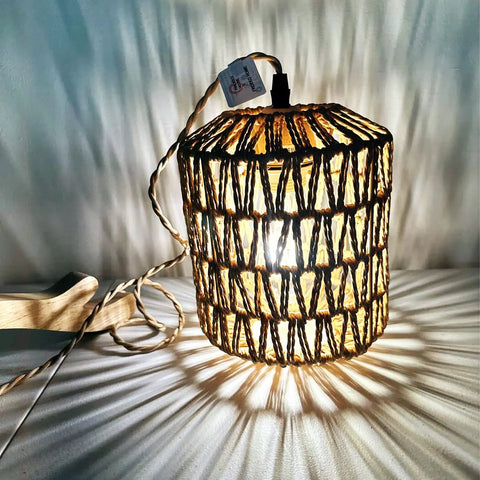 Rattan Wall Lamp With Plug In Cord Hand Woven Lantern Shade Farmhouse Wood Holder Boho Wall Sconce For Bedroom And Living Room Plug In Wall Light Cozy Rustic Decor with glowing pattern on wall.