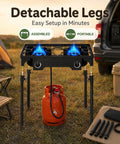 Two Burner Propane Stove For Outdoor Cooking With 150,000 BTU Total, Heavy Duty Camping Cooker with removable legs setup on grass