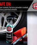Wheel Cleaner 16oz Tough Spray for Car Wash Detailing next to brush and chrome wheel, safe on coated and painted surfaces.