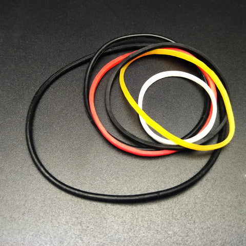 Colorful rubber bands from 82 Piece Plastic Gear Kit For DIY Toy Cars And Robots Complete Gear Pack with pulleys and belts.