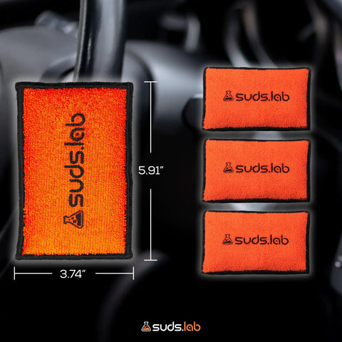 Microfiber Detailing Scrub Pads 2 Pack For Car Interior Cleaning And Detailing shown in orange with size dimensions