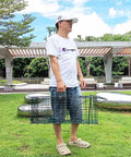 Person holding Foldable Humane Live Animal Cage Trap Kit 26 Inch No Kill Catch And Release Two Door Green outdoors