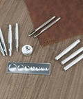 All In One Craft Tool Die Punch Snap Kit Rivet Setter With Base For DIY Projects on wooden surface and brown leather mat