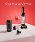 Rechargeable Wine Saver Pump With Vacuum Stopper Set, 4 Reusable Bottle Stoppers on table with wine bottle and glass