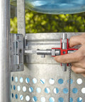 Universal Construction Control Cabinet Key with Plug In Magnetic Support unlocking an industrial cabinet, close-up view.
