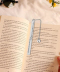 Gearhead Nerdy Twist Bookmark Gift With Velvet Pouch Stainless Steel Bookmark placed in an open book with mechanical design
