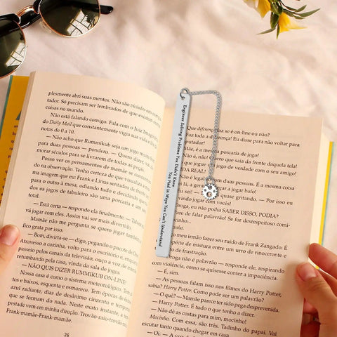 Gearhead Nerdy Twist Bookmark Gift With Velvet Pouch Stainless Steel Bookmark placed in an open book with mechanical design